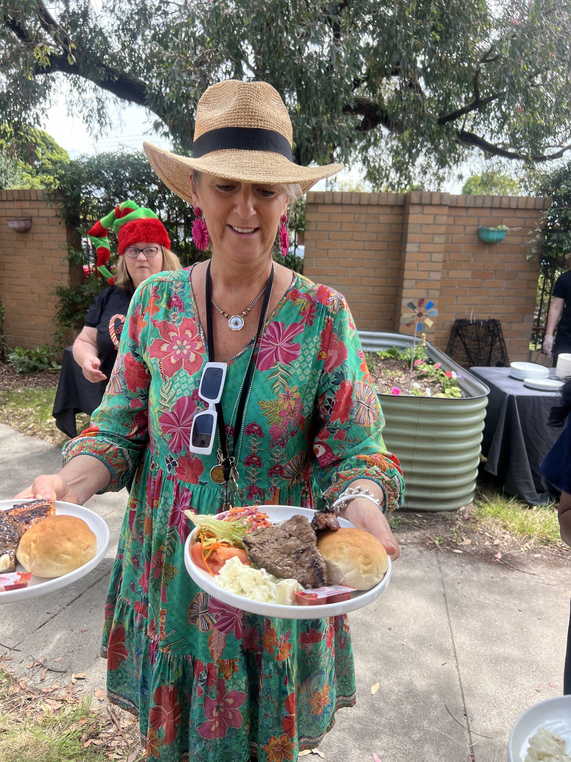 Woman holding plates of food