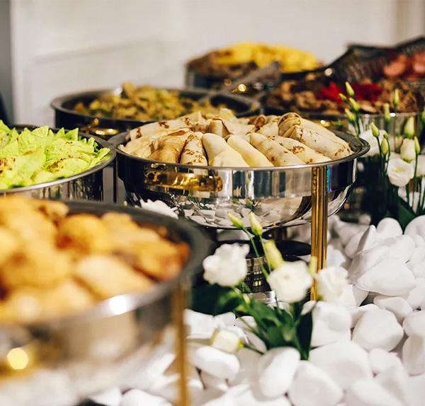 buffet dishes with food on a table