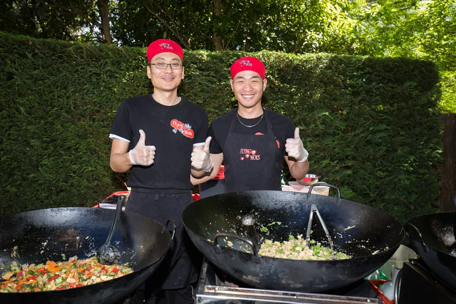 Flying Woks chefs at Philip's 70th birthday party in Melbourne garden