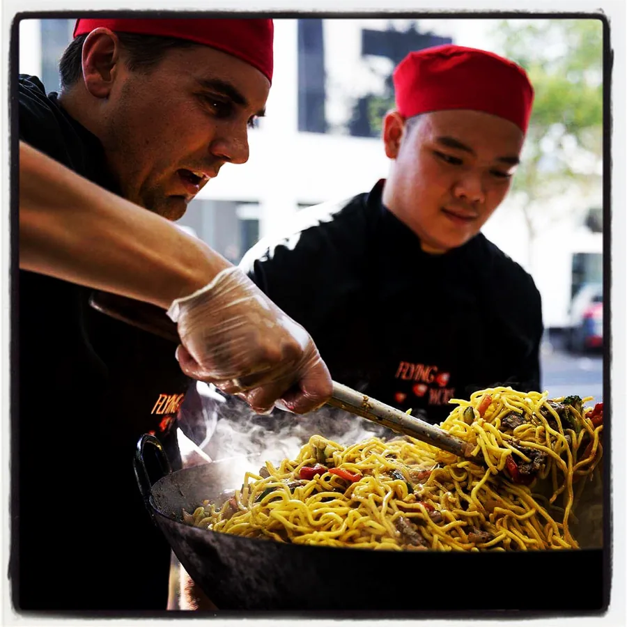 Flying Woks chefs cooking live at a birthday party in Melbourne