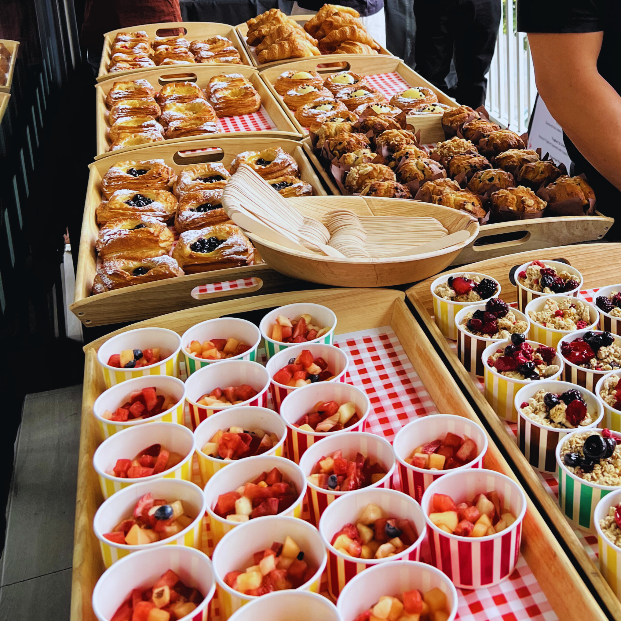 Flying Woks breakfast catering spread - pastries fruit cups and granola pots Melbourne