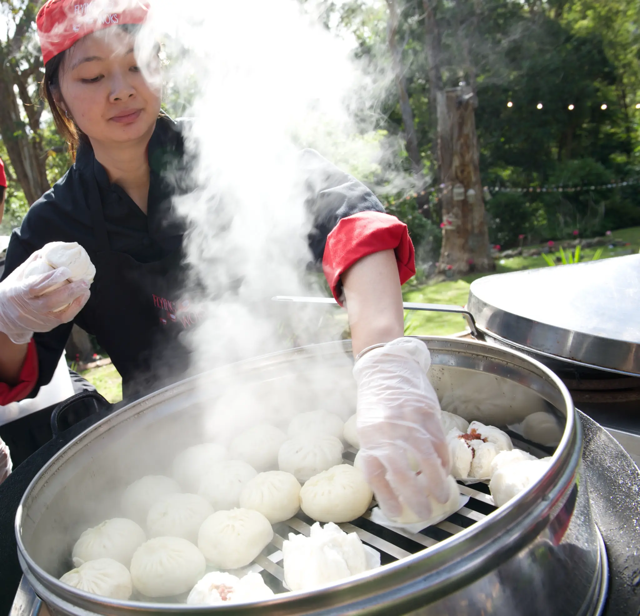 Steamed bao buns freshly prepared at a Melbourne event - Flying Woks