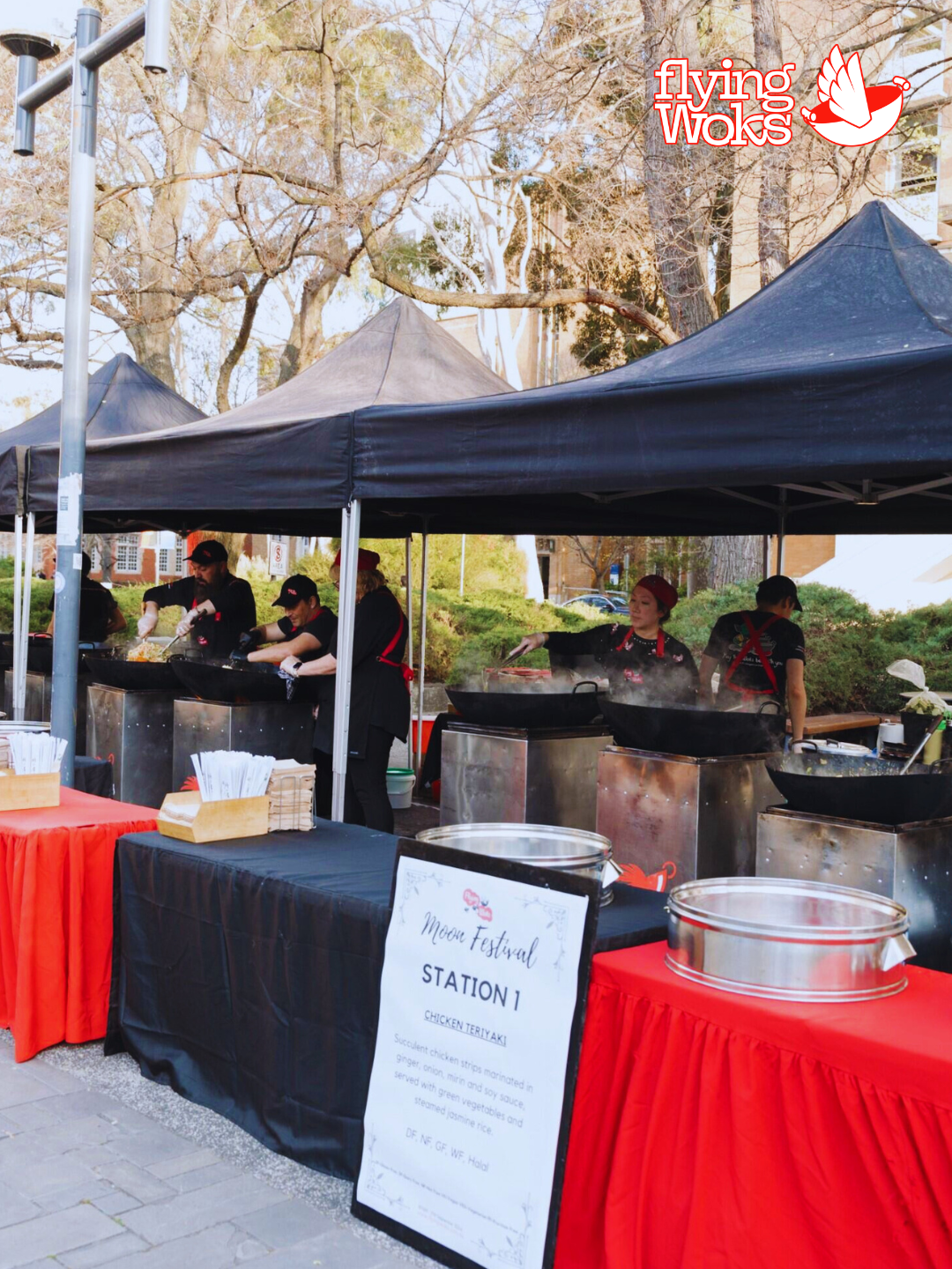 Flying Woks chefs cooking live at a corporate catering event Melbourne
