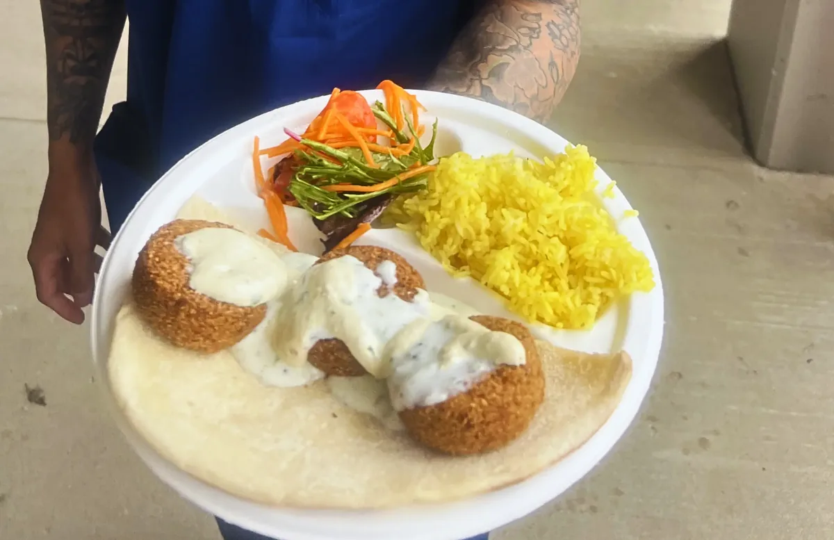 Flying Woks team serving Middle Eastern catering at Monash Health corporate Christmas party