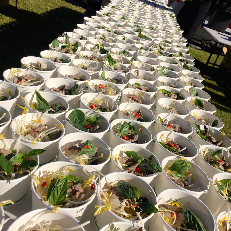 Large batch pho bo soup cups prepared for catering