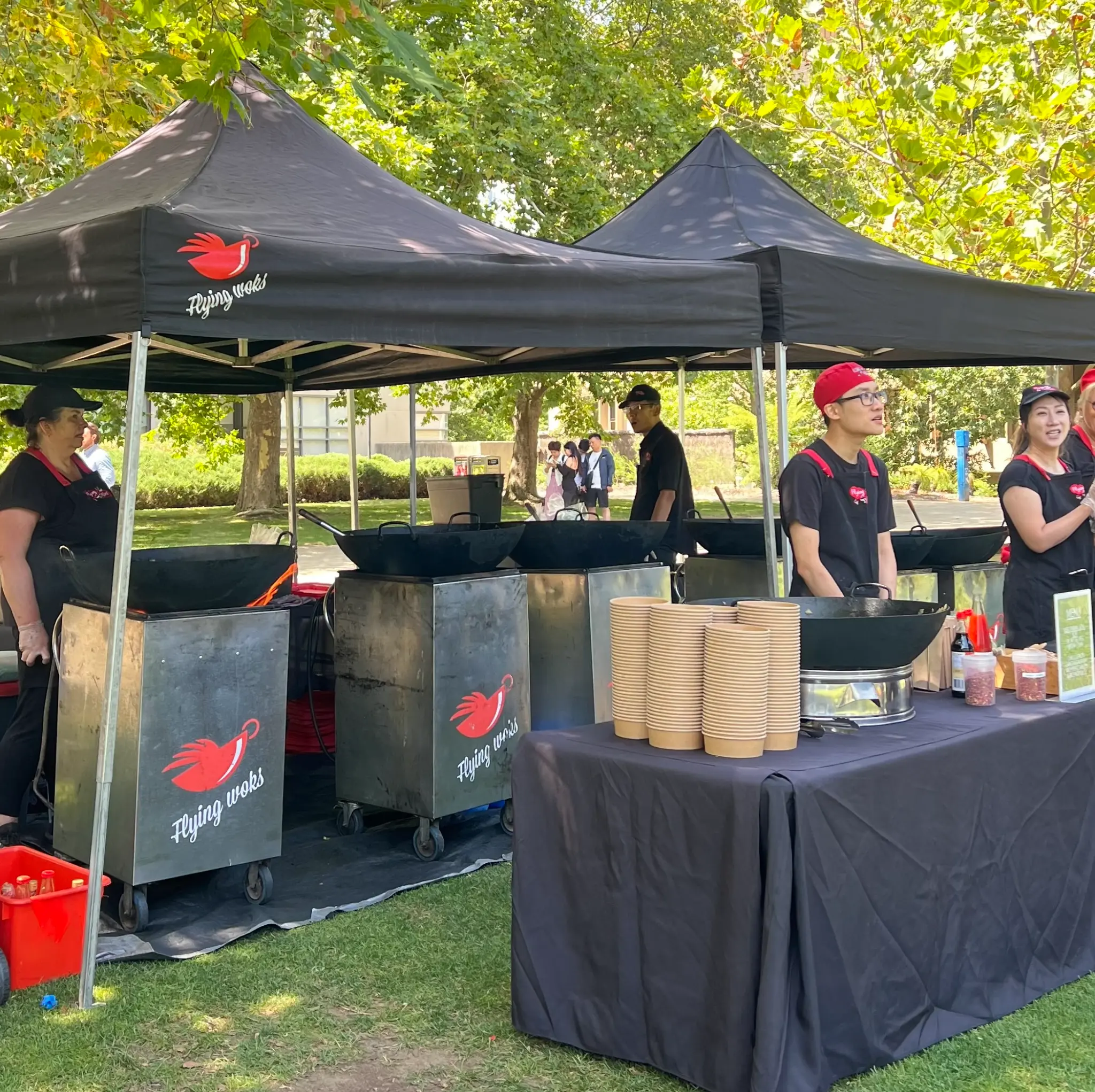 Flying Woks chefs cooking live pasta at a Melbourne corporate event marquee