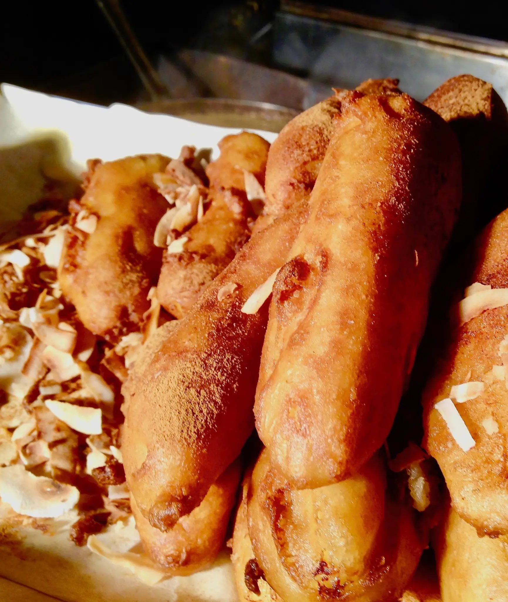Golden banana fritters with toasted coconut