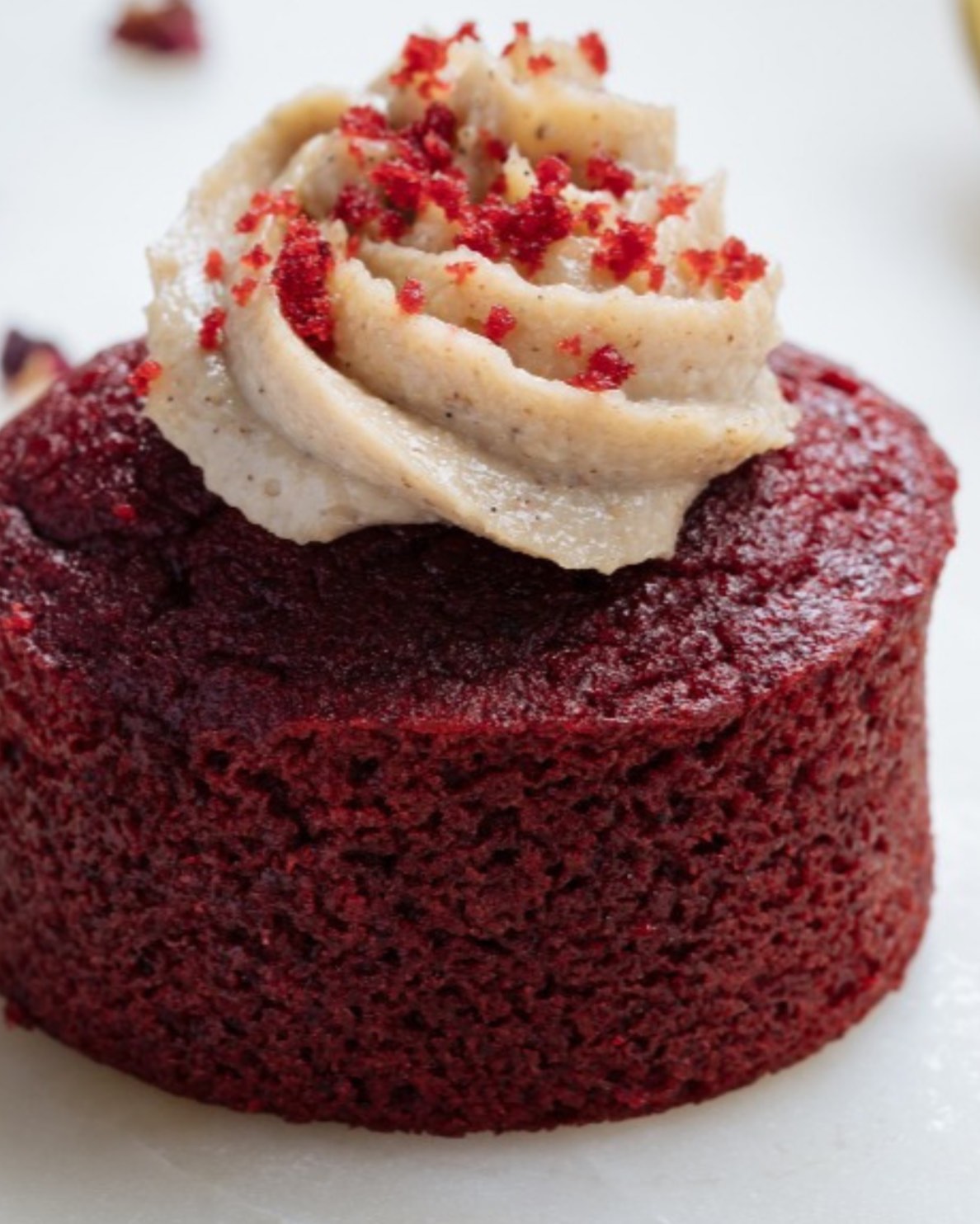 Red velvet cake with cashew cream and raspberry crumble